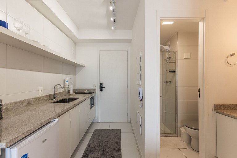 Studio com coworking, piscina e vista da cidade